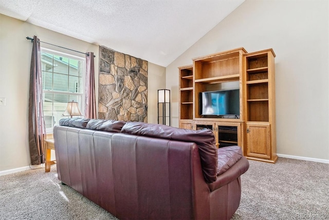 living room with carpet floors, a textured ceiling, and lofted ceiling