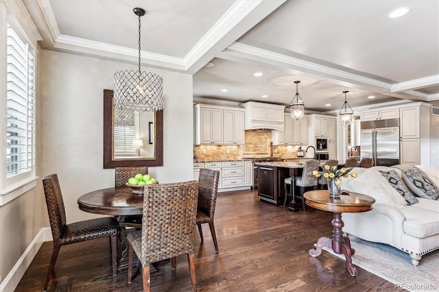 dining area featuring dark hardwood / wood-style flooring, crown molding, a wealth of natural light, and an inviting chandelier