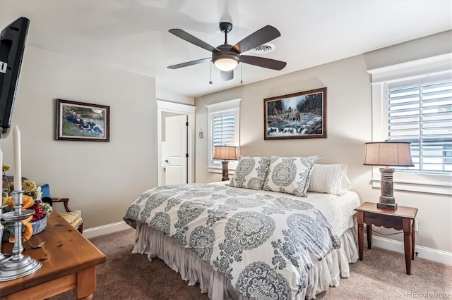 bedroom with multiple windows, carpet flooring, and ceiling fan