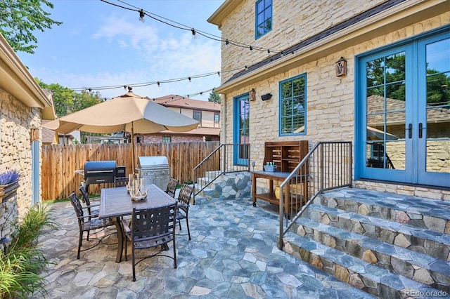 view of patio / terrace featuring french doors and grilling area