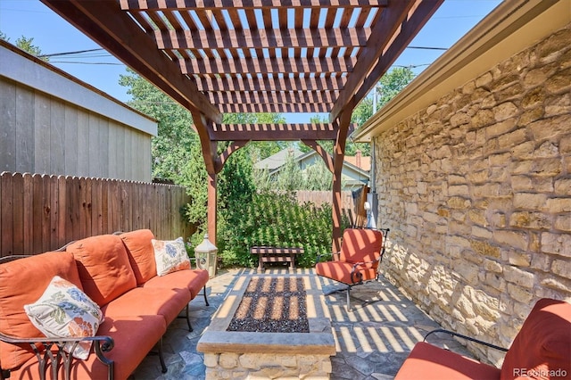 view of patio / terrace with an outdoor living space with a fire pit and a pergola