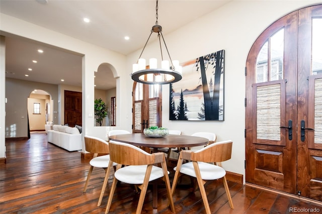 2435 S Milwaukee St, Denver, CO 80210 - dining area with arched walkways, french doors, wood-type flooring, a chandelier, and recessed lighting