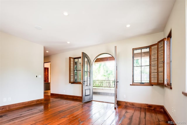 2435 S Milwaukee St, Denver, CO 80210 - empty room featuring hardwood / wood-style floors, baseboards, and recessed lighting