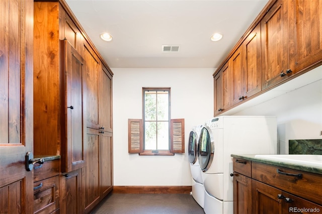 2435 S Milwaukee St, Denver, CO 80210 - laundry area with washer and dryer, cabinet space, baseboards, dark colored carpet, and recessed lighting