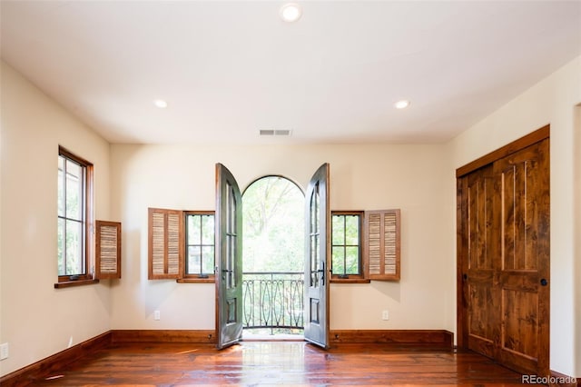 2435 S Milwaukee St, Denver, CO 80210 - foyer with wood finished floors, baseboards, and recessed lighting
