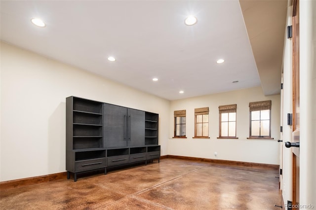 2435 S Milwaukee St, Denver, CO 80210 - unfurnished living room with baseboards, finished concrete flooring, and recessed lighting