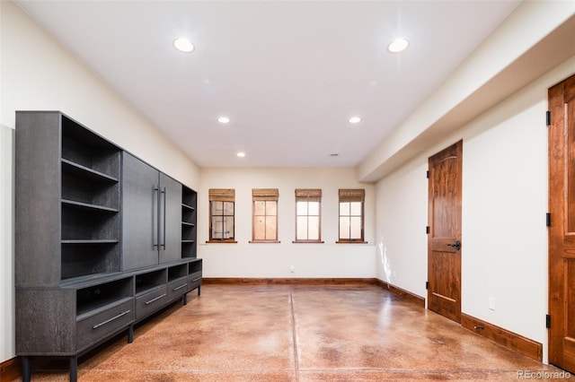 2435 S Milwaukee St, Denver, CO 80210 - unfurnished living room featuring baseboards, recessed lighting, and finished concrete flooring