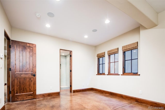 2435 S Milwaukee St, Denver, CO 80210 - unfurnished bedroom featuring baseboards, recessed lighting, and finished concrete floors