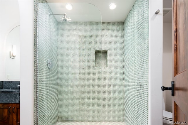 details with vanity and tiled shower