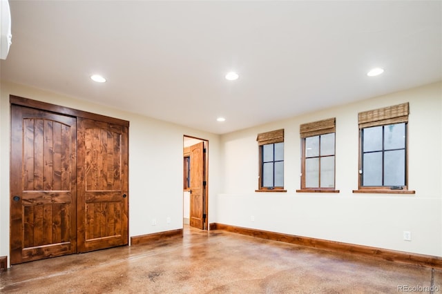 2435 S Milwaukee St, Denver, CO 80210 - unfurnished bedroom with baseboards and recessed lighting