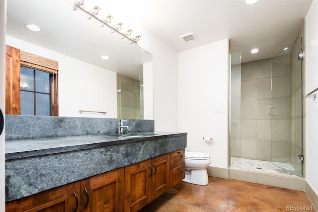 bathroom featuring vanity, toilet, a shower with door, and concrete flooring