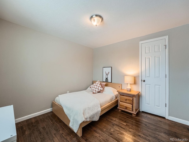 bedroom featuring dark hardwood / wood-style floors