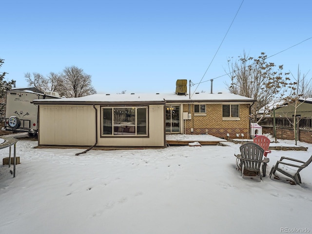 view of snow covered house