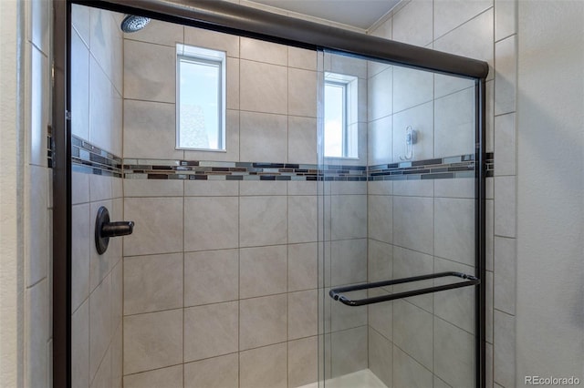 bathroom featuring an enclosed shower