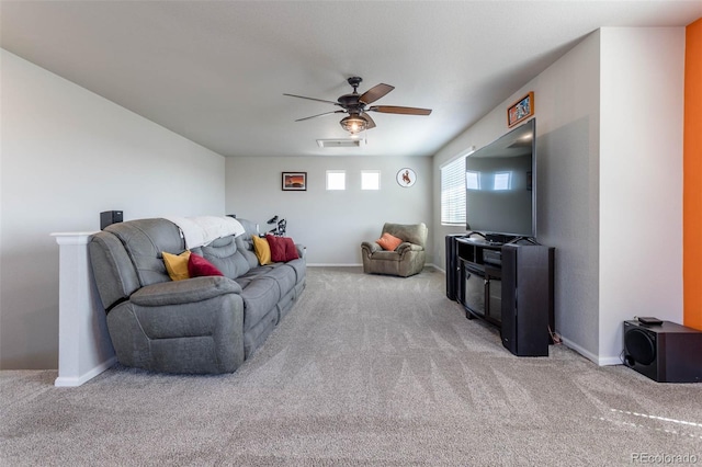 living area with a ceiling fan, carpet, visible vents, and baseboards