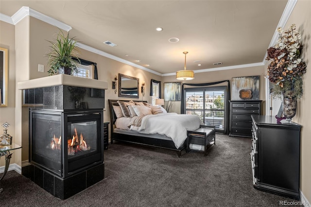 bedroom featuring ornamental molding and dark carpet