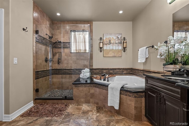 bathroom featuring vanity and plus walk in shower