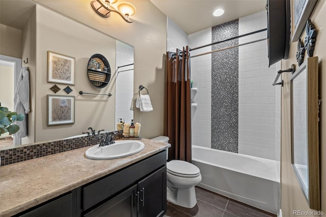 full bathroom featuring shower / tub combo, backsplash, vanity, tile patterned floors, and toilet