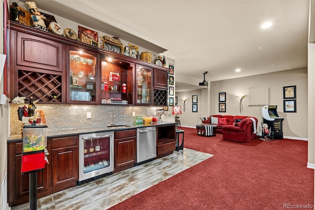 kitchen with sink, wine cooler, tasteful backsplash, carpet floors, and stainless steel dishwasher