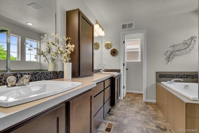 5558 Malta St, Denver, CO 80249 - full bathroom featuring double vanity and a bath