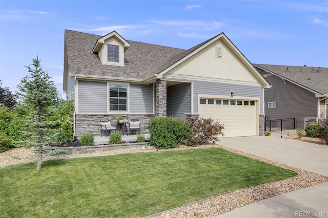5280 Genoa St, Denver, CO 80249 - craftsman-style home featuring stone siding, concrete driveway, a garage, and a shingled roof