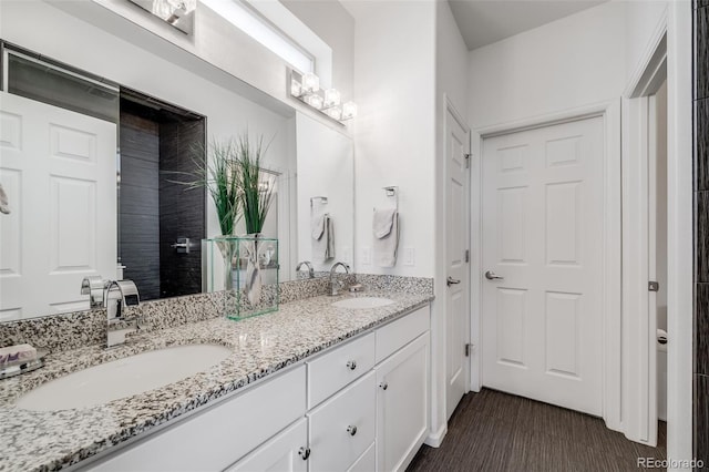 5280 Genoa St, Denver, CO 80249 - bathroom with double vanity and wood finished floors
