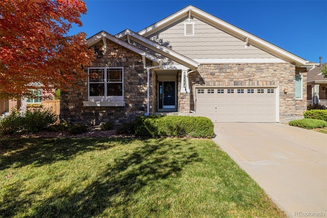 craftsman-style home featuring a front lawn, stone siding, a garage, and driveway