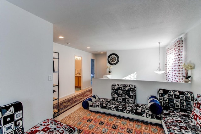 living room featuring a textured ceiling