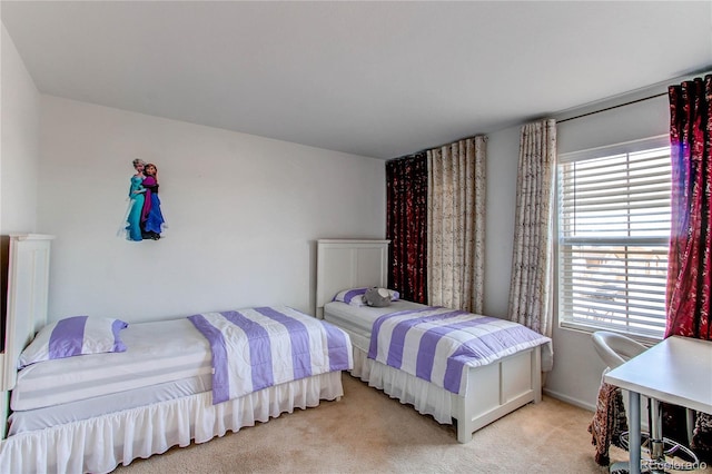 carpeted bedroom with multiple windows