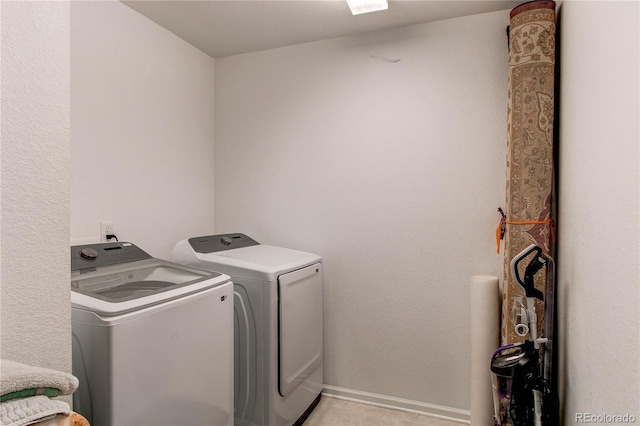 clothes washing area featuring washing machine and dryer