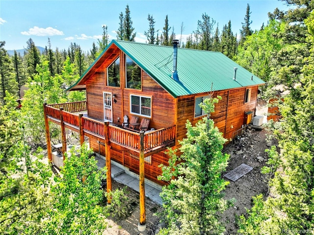36 Gitche Goone Ln, Como, CO 80432 - back of house featuring a wooden deck and a metal roof