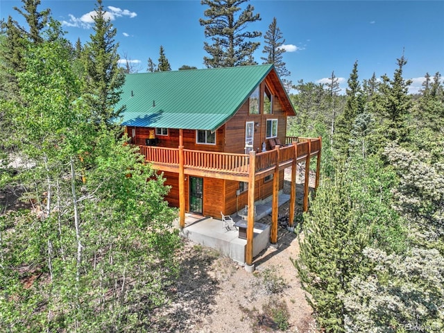 36 Gitche Goone Ln, Como, CO 80432 - back of property featuring a patio area, a wooden deck, and a metal roof