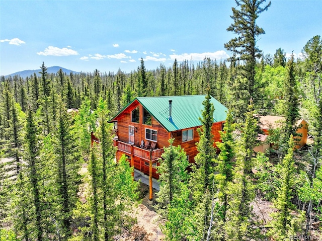 36 Gitche Goone Ln, Como, CO 80432 - view of front of home with a wooded view, a metal roof, and a wooden deck