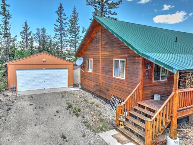 36 Gitche Goone Ln, Como, CO 80432 - view of home's exterior with an outbuilding, a garage, and a metal roof