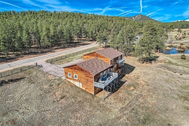 bird's eye view featuring a wooded view