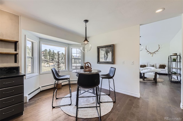 dining area with recessed lighting, baseboards, and dark wood-style floors
