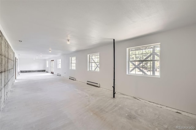 below grade area with a baseboard radiator and baseboard heating