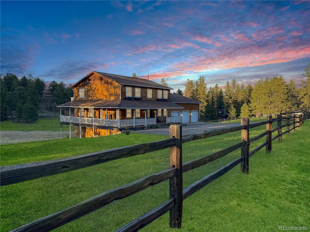 2635 Nova Rd, Pine, CO 80470 - country-style home with asphalt driveway, a porch, and an attached garage