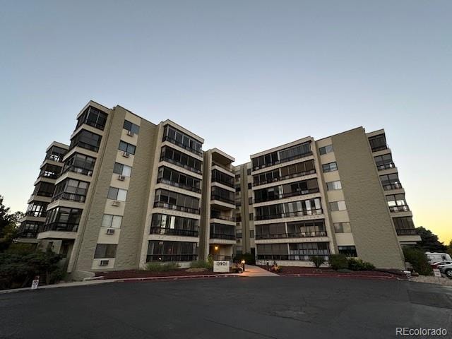 view of outdoor building at dusk