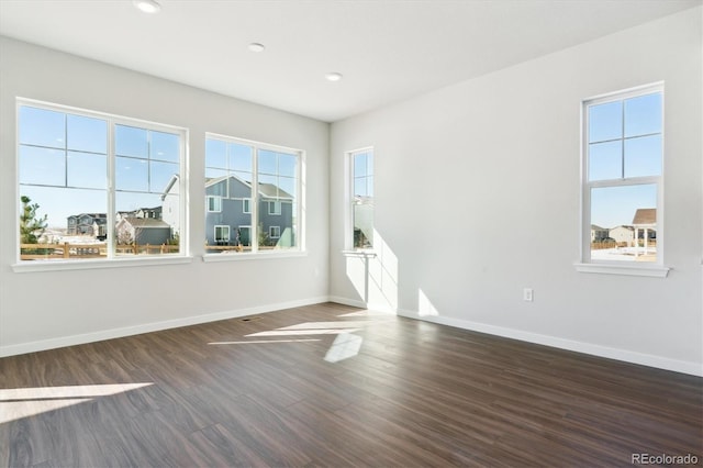 13765 Emerald Lake St, Parker, CO 80138 - unfurnished room with baseboards, wood finished floors, and recessed lighting