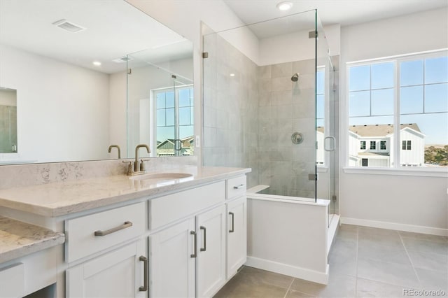 13765 Emerald Lake St, Parker, CO 80138 - bathroom with baseboards, tile patterned floors, a shower stall, vanity, and recessed lighting