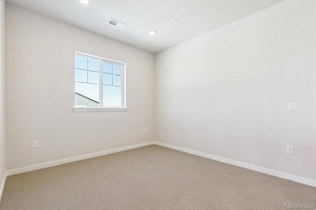 13765 Emerald Lake St, Parker, CO 80138 - spare room with light colored carpet, baseboards, and recessed lighting