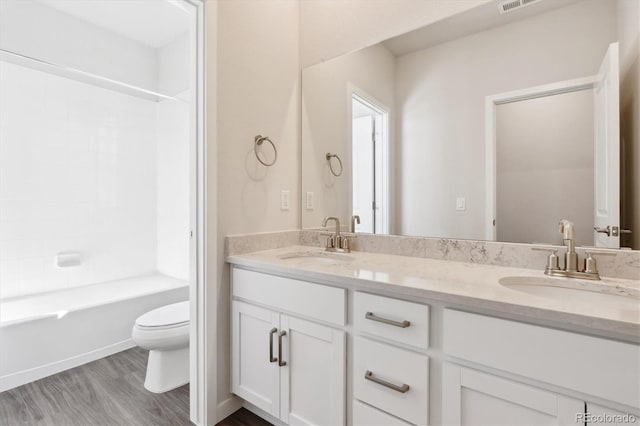 13765 Emerald Lake St, Parker, CO 80138 - full bath with toilet, double vanity, bathtub / shower combination, and wood finished floors
