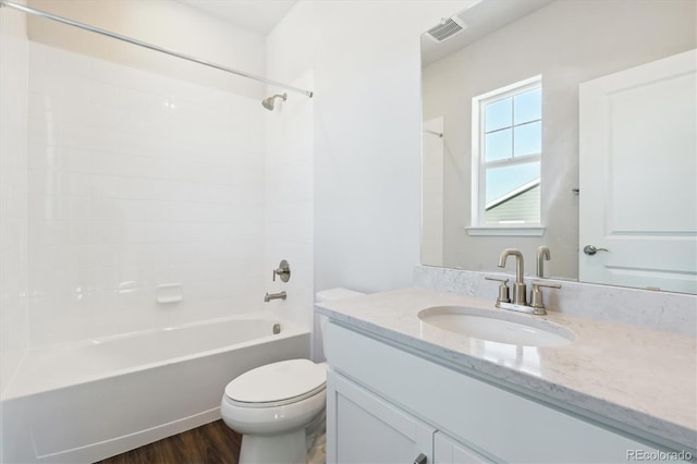 13765 Emerald Lake St, Parker, CO 80138 - full bathroom featuring toilet, bathtub / shower combination, vanity, and wood finished floors