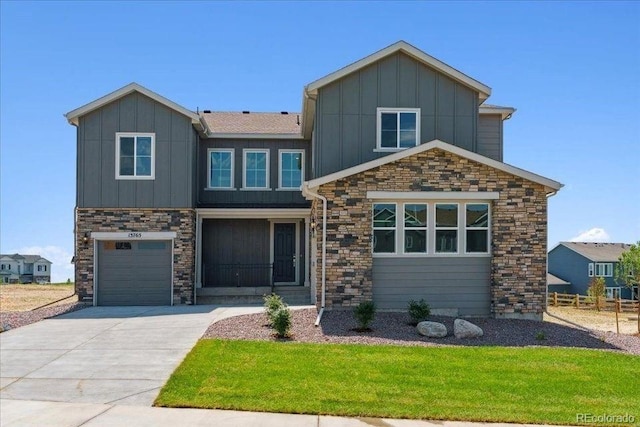 13765 Emerald Lake St, Parker, CO 80138 - view of front of house featuring board and batten siding, concrete driveway, stone siding, and an attached garage