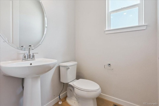13765 Emerald Lake St, Parker, CO 80138 - bathroom featuring baseboards and wood finished floors