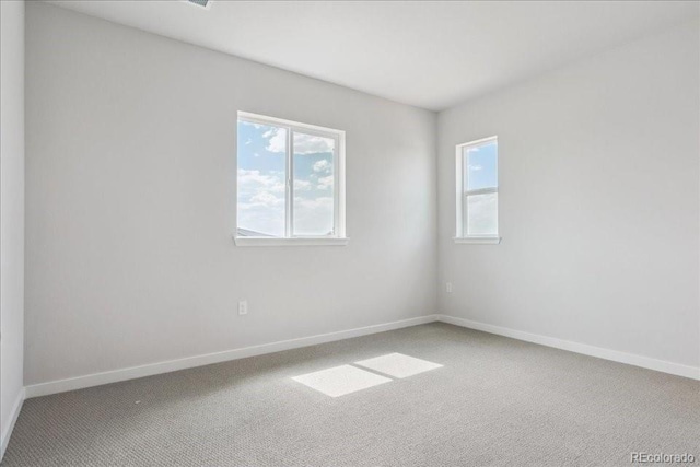 13765 Emerald Lake St, Parker, CO 80138 - empty room featuring healthy amount of natural light and carpet flooring