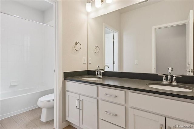 13765 Emerald Lake St, Parker, CO 80138 - full bath featuring double vanity, washtub / shower combination, and wood finished floors