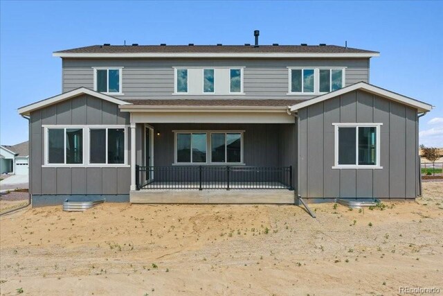 13765 Emerald Lake St, Parker, CO 80138 - rear view of property with a patio and board and batten siding