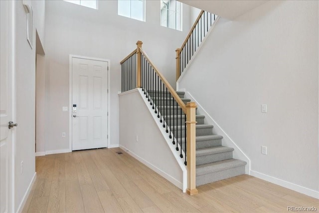 13765 Emerald Lake St, Parker, CO 80138 - foyer featuring wood finished floors, stairway, and a high ceiling